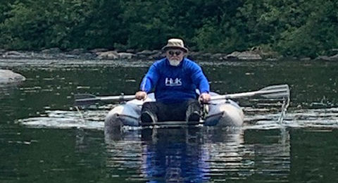 The Preacher, Nathaniel, paddling a Float Tube